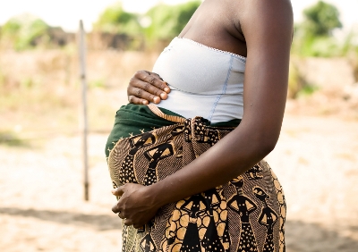 Pregnant woman in Africa holding bump