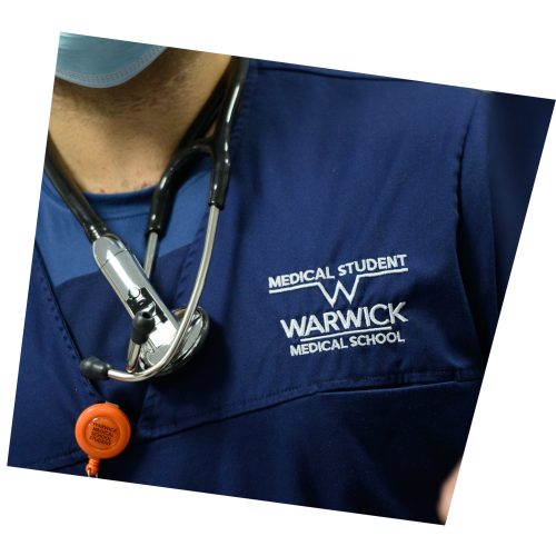 MB ChB scrubs tilted close up image showing stethoscope around neck