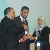 Photograph of Tahani receiving the award