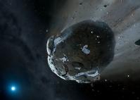 Artist impression of a rocky and water-rich asteroid being torn apart by the strong gravity of the white dwarf star GD 61. Similar objects in the Solar System likely delivered the bulk of water on Earth and represent the building blocks of the terrestrial planets. Image copyright Mark A. Garlick, space-art.co.uk, University of Warwick and University of Cambridge.