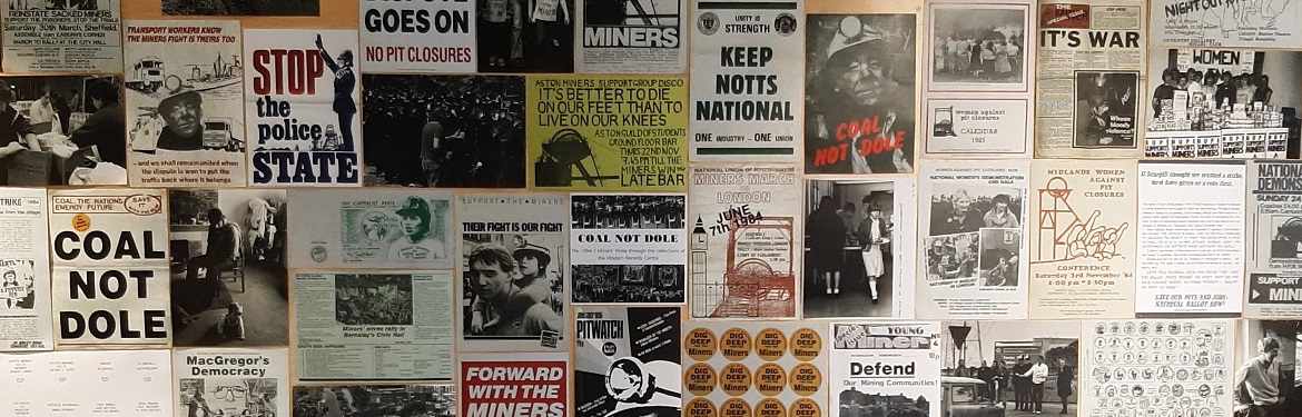 Image of posters relating to the 1984/5 miners' strike on an exhibition wall