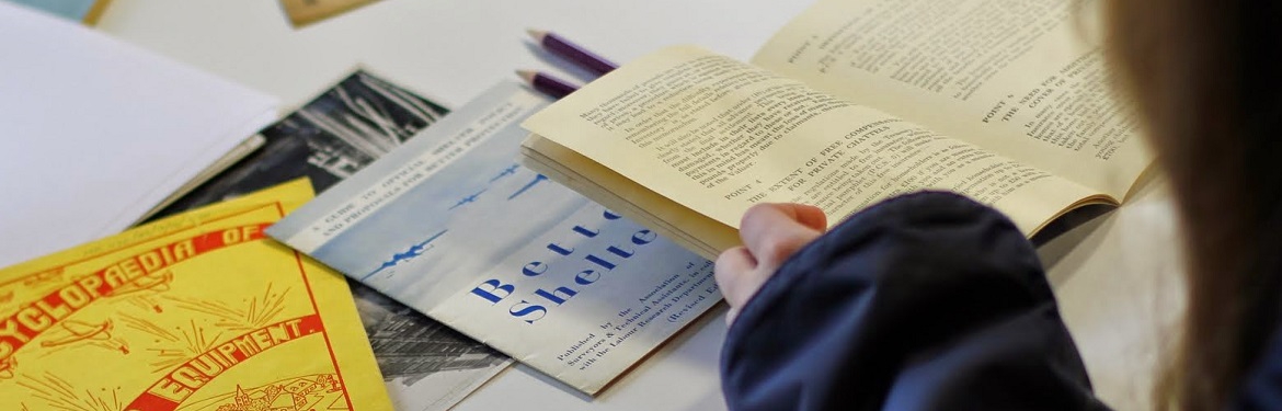 Photograph of student looking at pamphlets